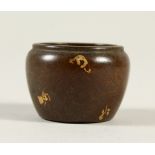 A MINIATURE CIRCULAR GOLD SPLASH BRONZE CENSER. 3.5cms diameter.