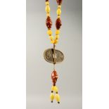A CARVED NUT AND BEAD NECKLACE. 55cms long.