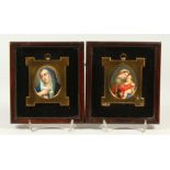 A PAIR OF FRAMED AND GLAZED OVAL PORCELAIN PANELS of Madonna and Child, and The Blue Madonna. 8cm