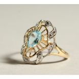 A 9CT GOLD, BLUE TOPAZ AND DIAMOND RING.