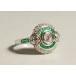 A SILVER AND GREEN PASTE DECO STYLE RING.