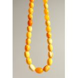 A BEAD NECKLACE OF SIMULATION AMBER