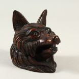 A BLACK FOREST STYLE CARVED WOOD FOXES HEAD INKWELL. 9cms high.