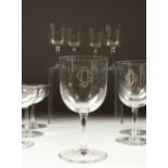 A PART SUITE OF DRINKING GLASSES, comprising five large wine glasses, four small wine glasses and