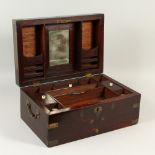 A 19TH CENTURY BRASS ANGLO INDIAN PADOUK WOOD TRAVELLING BOX, the interior fitted with a mirror,