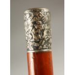 A MALACCA WALKING STICK, with Chinese silver handle. 85cms long.