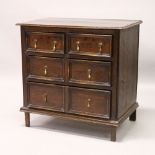 AN 18TH CENTURY OAK CHEST OF DRAWERS, with two short and two long moulded drawers on later legs.
