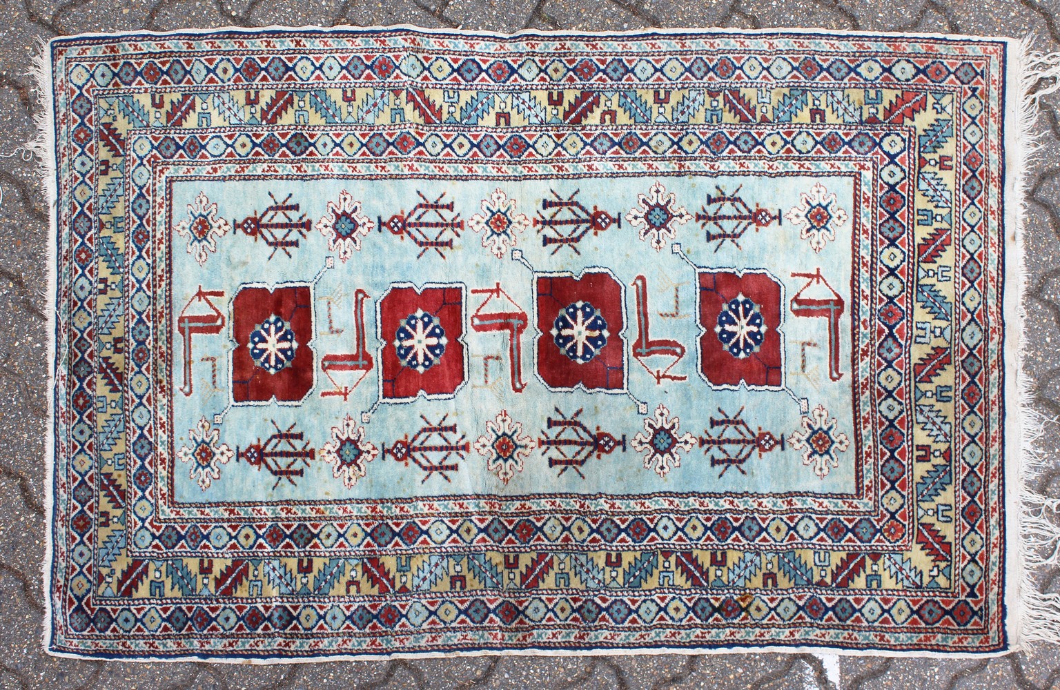 A PERSIAN RUG, pale blue ground, with four large motifs and stylised bird decoration. 152cm x