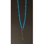 A STRING OF TURQUOISE AND SILVER BEADS.