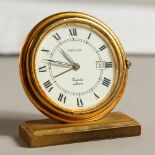 A SMALL TURLER TRAVELLING CLOCK.