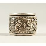 A CHINESE WHITE METAL ARCHERS RING. 3cms diameter.