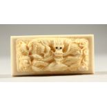 A BONE RECTANGULAR SNUFF BOX AND COVER, the lid carved with a dragon. 7cms long.