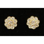 A PAIR OF 18CT YELLOW GOLD DAISY STYLE DIAMOND EARRINGS.