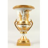 A CONTINENTAL CAMPAGNA SHAPE PORCELAIN URN, with gilded decoration depicting Chinese figures in a