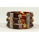 A TORTOISESHELL and SILVER BRACELET.