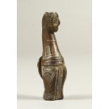 A SMALL BRONZE AND GOLD EGYPTIAN FIGURE. 4.5cms long.