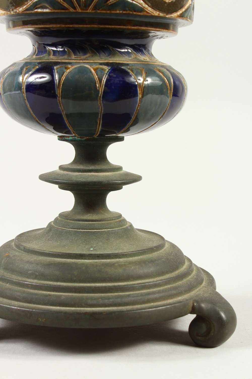 A DOULTON LAMBETH STONEWARE VASE, on a cast iron stand. 33cm high. - Image 3 of 8