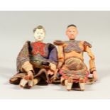 TWO CHINESE PAPIER MACHE FIGURES, in colourful dress. 26cms high.