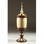 A 1920'S CONTINENTAL TURNED WOOD AND IVORY CHALICE AND COVER, the lid with a turned spire. 37cms