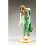 A GOOD MEISSEN FIGURE OF A YOUNG LADY, leaning forward, a ball in her hand, crossed swords mark to