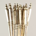 A SET OF FOURTEEN .800 SILVER LONG HANDLED TEASPOONS.