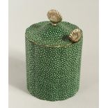 A SHAGREEN CIRCULAR TEA CADDY AND COVER with spoon. 12cms high.