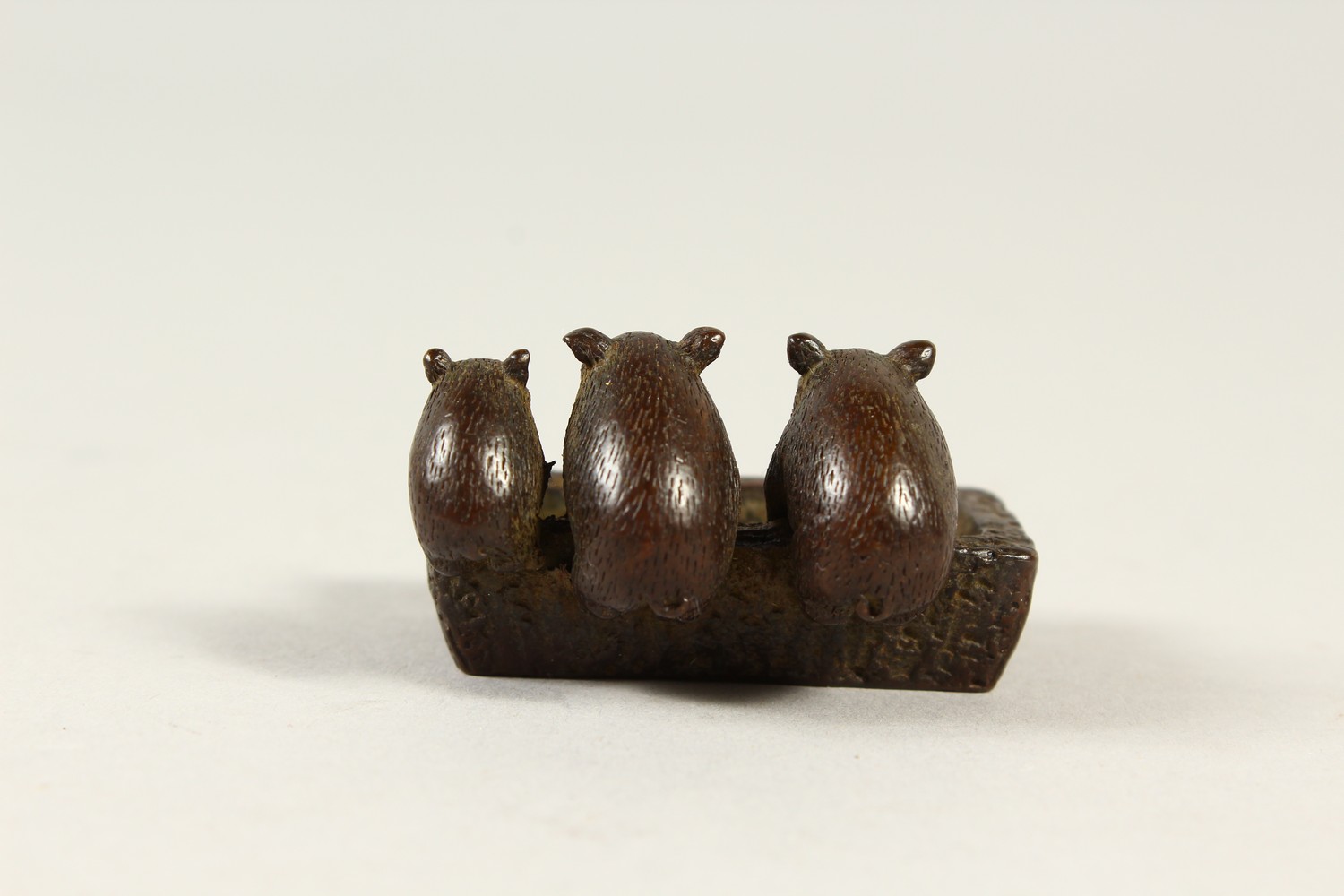 A SMALL BRONZE GROUP OF PIGS AT A TROUGH. 4.5cms wide. - Image 2 of 4