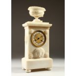 A FRENCH EMPIRE CLOCK, with white enamel chapter ring, ornate dial and bezel, in a carved