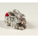 A SILVER NOVELTY RABBIT PIN CUSHION.