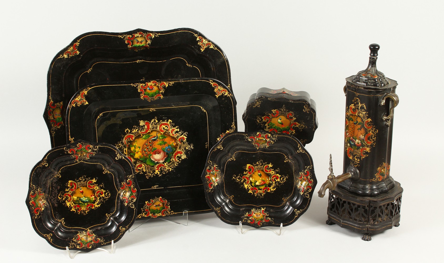 A RARE 19TH CENTURY TOLEWARE SET, comprising tea urn, shaped base, pair of waiters and two trays.