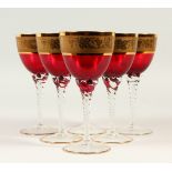 A SET OF SIX SHORT STEM, RED AND GOLD GOBLET GLASSES.