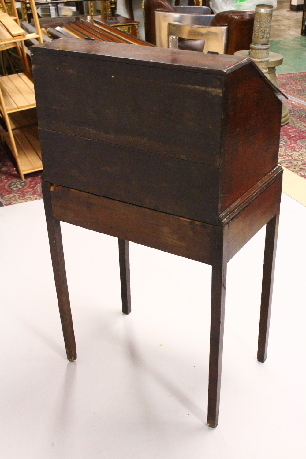 AN 19TH CENTURY OAK DESK ON STAND, with sloping front, fitted interior with small drawers, on a - Image 9 of 19