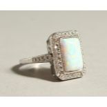 A SILVER AND GILSON OPAL DECO STYLE RING.