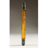 A LONG VICTORIAN AMBER GLASS DOUBLE ENDED SCENT BOTTLE with enamel ends. 20cms long.