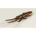 A BRONZE MODEL OF A STAG BEETLE. 13cms long.