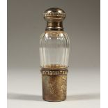 A GLASS SCENT BOTTLE with silver top and base. 8.5cms high.