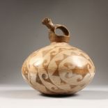 A SIMILAR PERUVIAN WINE JUG with animal handle. 20cms high x 18cms wide.