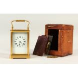 A 19TH CENTURY FRENCH BRASS CARRIAGE CLOCK, in a leather case. 15cms high.