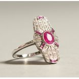 A 9CT GOLD, DIAMOND AND RUBY DECO STYLE RING.