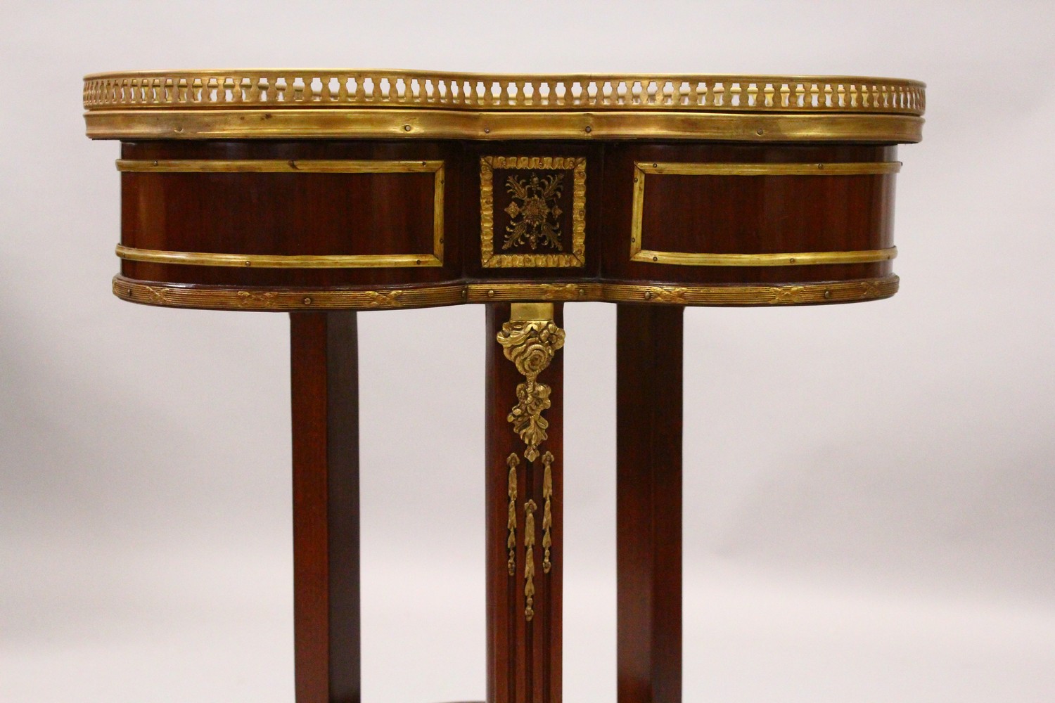 A FRENCH STYLE MAHOGANY, ORMOLU AND MARBLE TWO TIER TREFOIL SHAPE TABLE. 55cm wide x 75cm high. - Image 2 of 6