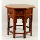 A MOORISH BONE INLAID OCTAGONAL TABLE, with folding base. 51cms wide x 52cms high.