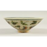 A SMALL CIRCULAR CONICAL SHAPE BOWL, decorated with butterflies. 17.5cms diameter.