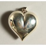 A SILVER HEART SHAPE PENDANT