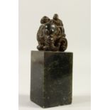 A HARDSTONE SQUARE SHAPE SEAL, carved with an elephant. 16cms high.