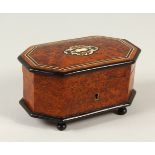 A SMALL BURR WOOD CASKET, with inlaid decoration. 16cm wide.