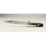 A FOLDING BOWIE KNIFE, with stag horn grips, in a leather sheath. 31cms long (open).