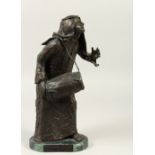 ANNE ROONEY (20TH CENTURY) AMERICAN A BRONZE FIGURE HOLDING A LARGE DRUM, on a shaped marble base.