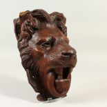 A 19TH CENTURY CARVED WOOD LION MASK. 22cms long.