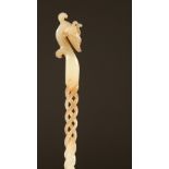 A WHITE JADE CARVED AND PIERCED HAIR PIN. 24cms long.