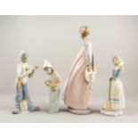 FOUR VARIOUS LLADRO AND NAO PORCELAIN FIGURES, including The Clown. 33cm, 22cm (2) and 20cm high.